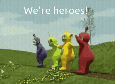 Teletubbies Standing In Grassy Field Saying We're Heroes GIF