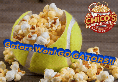 Tennis Ball Filled With Popcorn Next To Chico's Kettle Corn Sign GIF