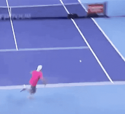 Tennis Player Hitting Ball On Purple Court With Tour On Net GIF