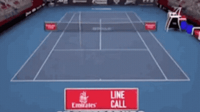 Tennis Player Hitting Ball With Line Call Sign GIF
