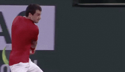 Tennis Player Hitting Ball With Rolex Ad GIF