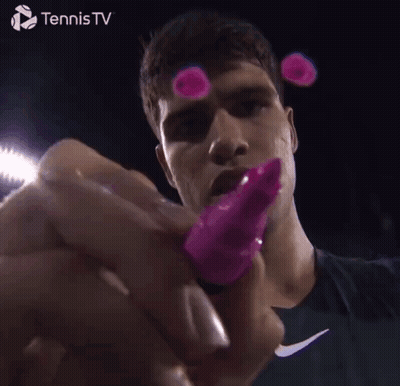 Tennis Player Holding Pink Object GIF