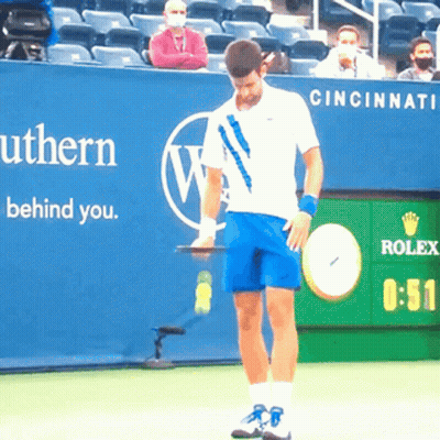 Tennis Player Holding Racquet In Front Of Rolex Sign GIF