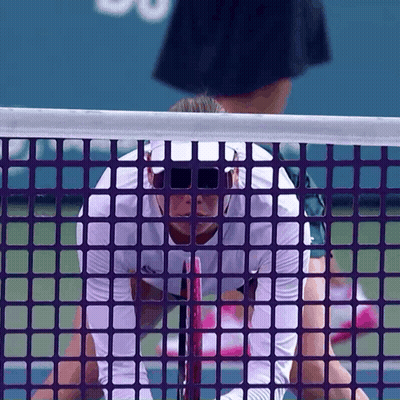 Tennis Player In Sunglasses Behind Purple Net GIF