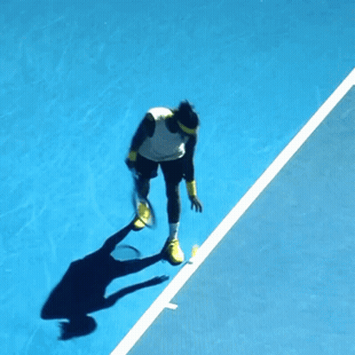 Tennis Player Jumping Holding Racquet GIF