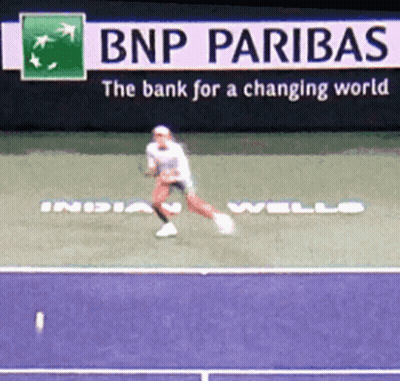 Tennis Player Jumping Near Paribas Sign GIF