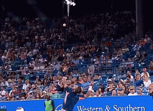 Tennis Player Jumping With Western & Southern Advertisement GIF