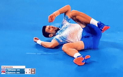 Tennis Player Lying On Ground Legs Crossed GIF