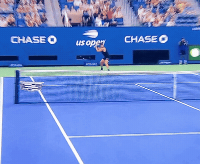 Tennis Player On Blue Court With Chase Us Open Ads GIF