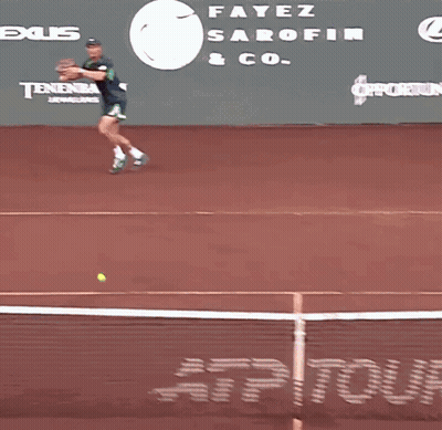 Tennis Player Running On Court In Front Of Tennis Channel Banner GIF