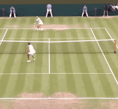 Tennis Player Running Towards Net With Racquet GIF