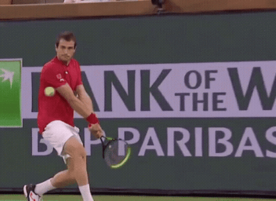 Tennis Player Swinging Racket In Front Of BNP Paribas Sign GIF