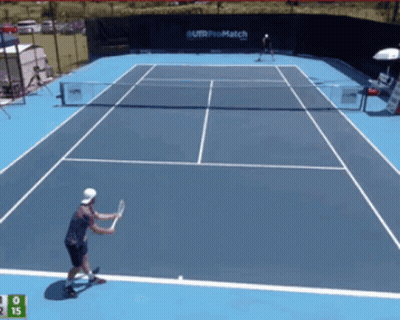 Tennis Player Swinging Racket In Front Of Telcel Sign GIF