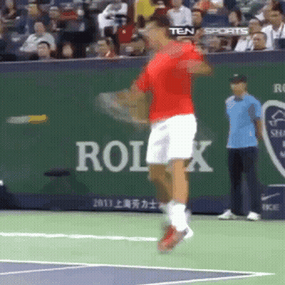 Tennis Player Swinging Racket With Rolex Ad GIF