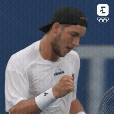 Tennis Player Wipes Face Holding Racquet GIF