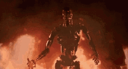 Terminator Skynet Walking Out Of Fire GIF