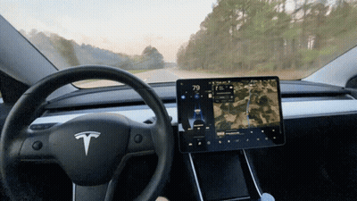 Tesla Driving Down Road At 79 Degrees GIF