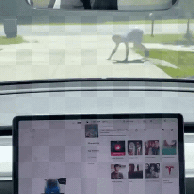 Tesla Model 3 Driving Down Road GIF