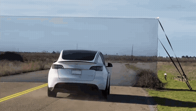 Tesla Model 3 Driving Down Road GIF