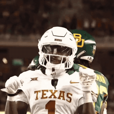Texas Football Player In White Helmet And Gloves GIF