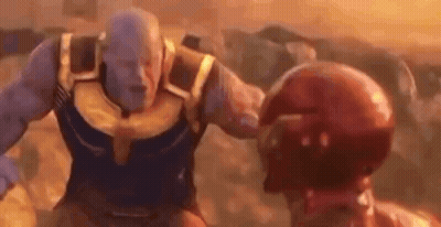 Thanos And Iron Man Are Fighting Each Other In A Movie Scene From Avengers Infinity War . GIF