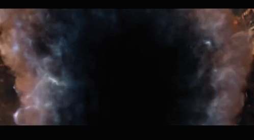 Thanos From Avengers Infinity War Is Looking At The Camera With A Beard And A Gold Vest . GIF