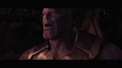 Thanos From Avengers Infinity War Is Smoking A Cigarette In A Dark Room . GIF