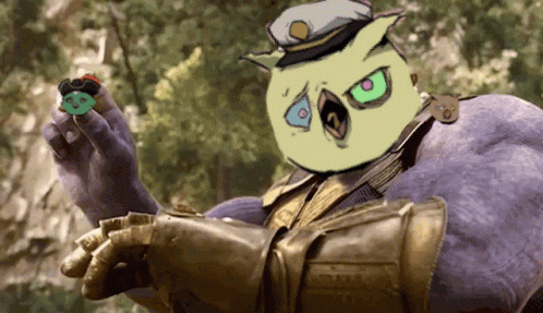 Thanos Holding Green Object With Yellow Face