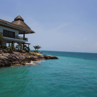 Thatched Roof House On Cliff GIF