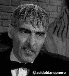 The Addams Family Lurch Smirking GIF