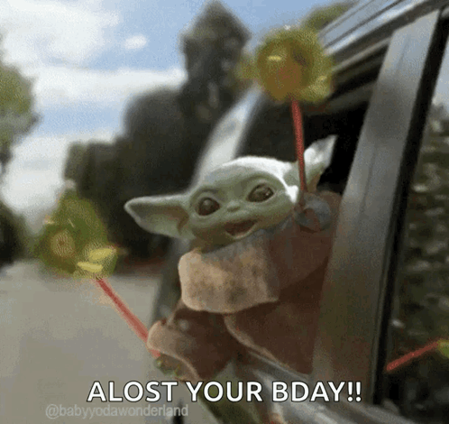The Baby Yoda Is Holding A Lollipop Out Of A Car Window And Says Alost Your Bday ! GIF