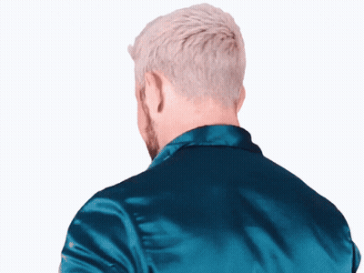 The Back Of A Man 'S Head Is Shown In A Blue Jacket GIF