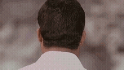 The Back Of A Man 'S Head Is Shown In This Close Up . GIF