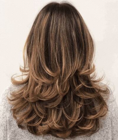 The Back Of A Woman 'S Hair With A Gray Sweater On GIF