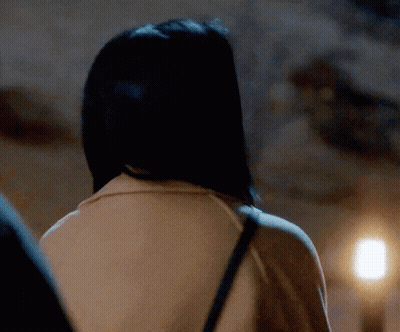 The Back Of A Woman 'S Head Is Shown In A Close Up GIF