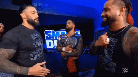 The Bloodline Roman Reigns Hugging Members GIF