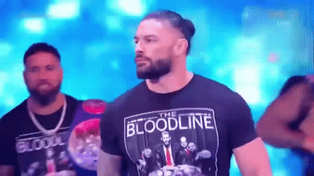 The Bloodline WWE Members Carrying Belts GIF