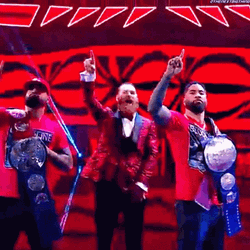 The Bloodline WWE Raising Their Hands GIF