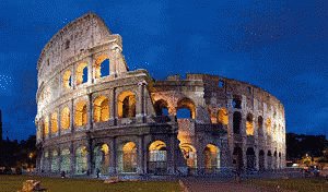 The Colosseum Is Lit Up At Night With A Blue Sky GIF