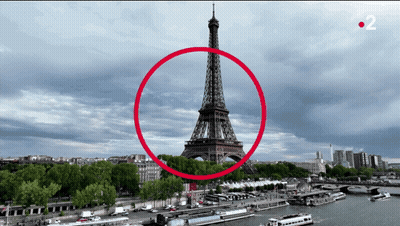 The Eiffel Tower Is Surrounded By A Red Circle With The Number 2 On The Bottom Right GIF