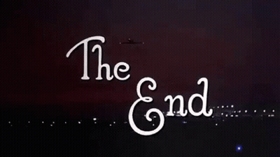 The End Is Written In White Letters On A Black Background With Fireworks Exploding In The Background . GIF