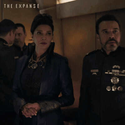 The Expanse Poster Woman And Man Standing Together GIF