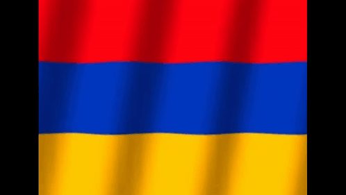 The Flag Of Armenia Is Red , Blue And Yellow And Is Waving In The Wind . GIF