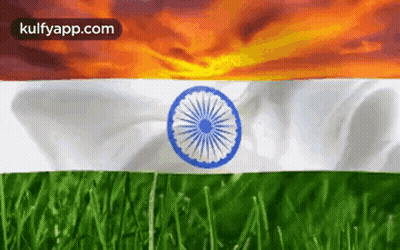 The Flag Of India Is Waving In The Wind With A Sunset In The Background GIF