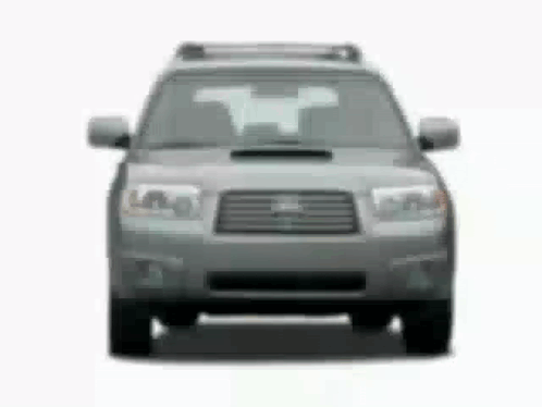 The Front Of A Subaru Forester Is Shown In A Black And White Photo . GIF