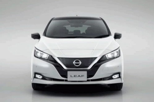 The Front Of A White Nissan Leaf With Black Trim GIF