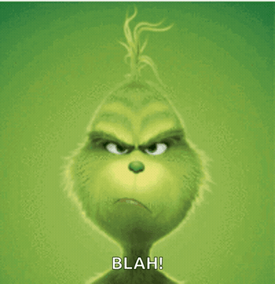 The Grinch From The Movie The Grinch Has A Very Angry Look On His Face And Says Blah GIF