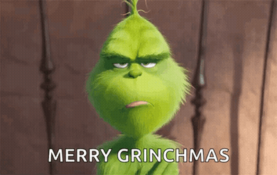 The Grinch From The Movie The Secret Life Of Dr. Seuss Is Looking At The Camera And Saying Merry Grinchmas . GIF