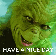 The Grinch Is Smiling And Says `` Have A Nice Day '' GIF