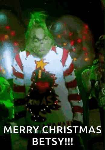 The Grinch Is Wearing A Christmas Sweater And Says Merry Christmas Betsy !! GIF